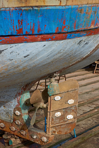 The rudder of a large fishing boat on a slipway in the historic harbour of Essaouira in Morocco.