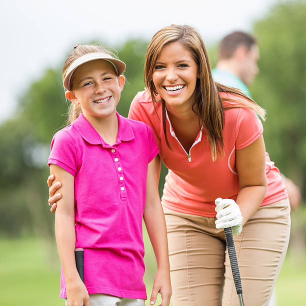 istock Mom & daughter playing golf together on course 176740360