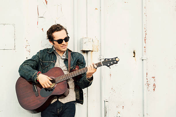 istock Handsome Male with Acoustic Guitar 176740494
