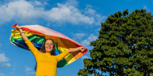 istock young woman outdoors with her hands open holding the flag 1767413124