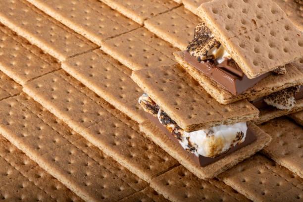 istock Graham or honey cracker background with S'mores. 1767415287