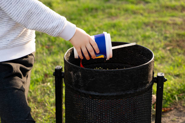 istock A child throws a plastic cup in the trash. Garbage recycling and plastic waste reduction concept 1767420460
