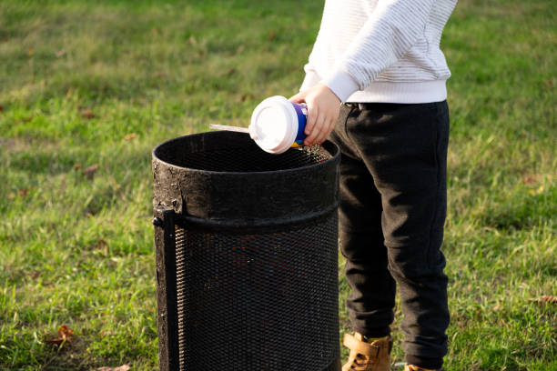 istock A child throws a plastic cup in the trash. Garbage recycling and plastic waste reduction concept 1767420467