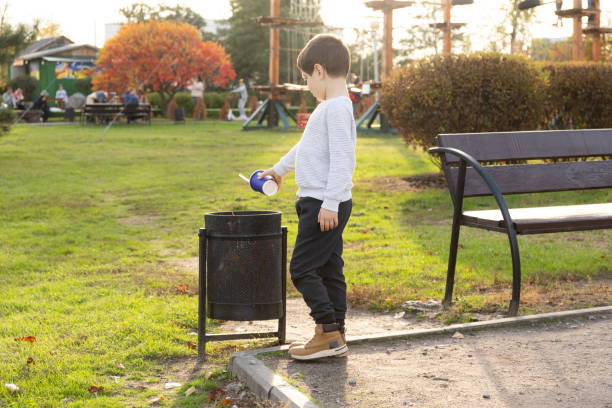 istock A child throws a plastic cup in the trash. Garbage recycling and plastic waste reduction concept 1767420785