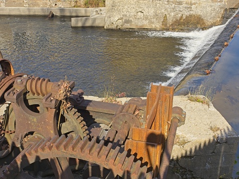 Spillway and weir control at old hydro powered paper mill along the Walloomsac river in Bennington Vermont.