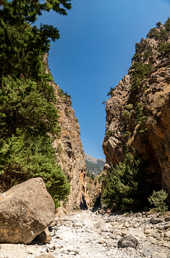 Breathtaking scenery of the Samaria Canyon on the Crete island in Greece. Tall stone formations and mountains