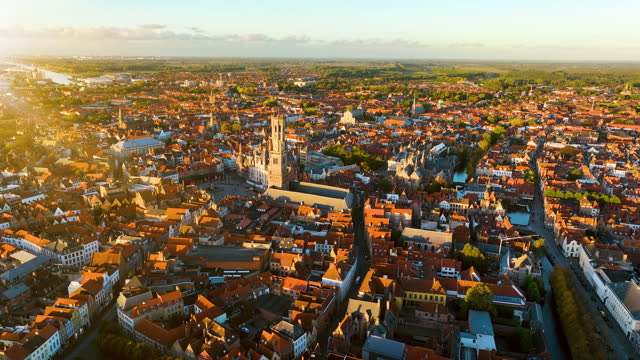 Aerial of Belfry of Bruges is a medieval bell tower in the centre of Bruges Belgium. 4k