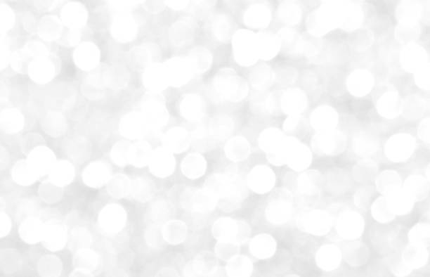istock White and gray bokeh background. Celebration background. 1767444798
