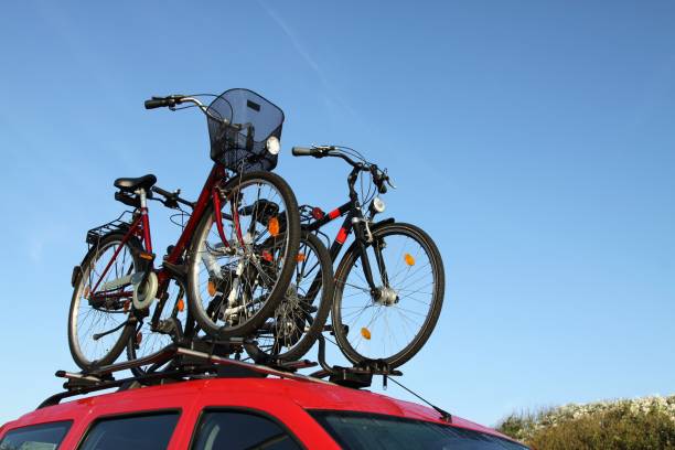istock bicycle rack on top of red car 1767458358
