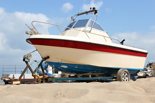 motorboat on trailer at sandy beach