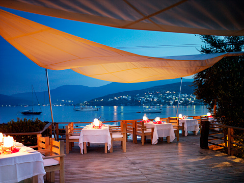 Romantic dinner setting by the sea