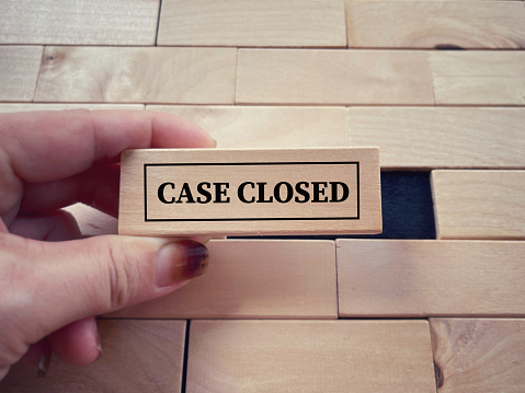 CASE CLOSED written on wooden blocks. With blurred styled background.