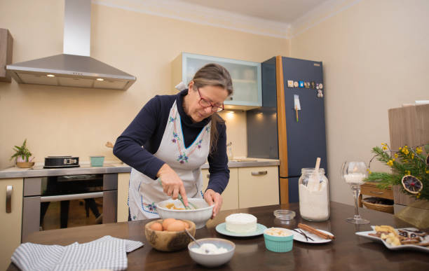 istock Senior Woman Baking in Domestic Kitchen 1767465508