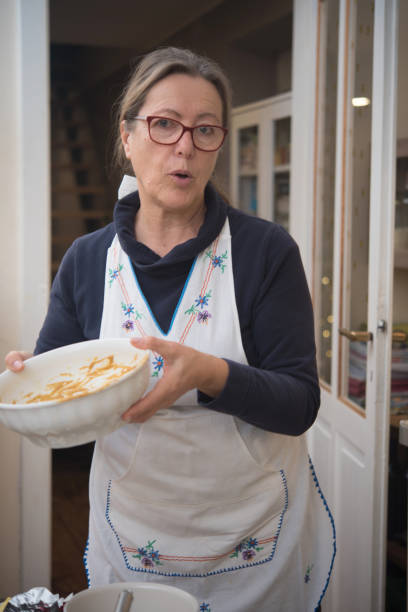 istock Senior Woman Making Faces Holding Empty Mixing Bowl 1767465552
