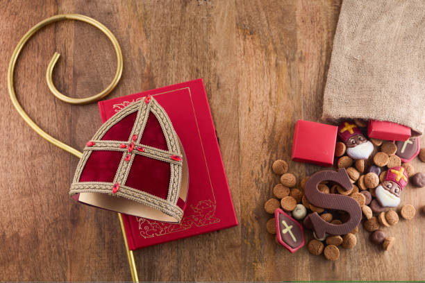 Dutch holiday Sinterklaas background with mitre or mijter staff and book of Sinterklaas. Dutch holiday Sinterklaas background with mitre or mijter staff and book of Sinterklaas mijter stock pictures, royalty-free photos & images