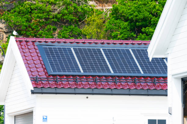 istock Solar panels on a garage roof.. 1767484665