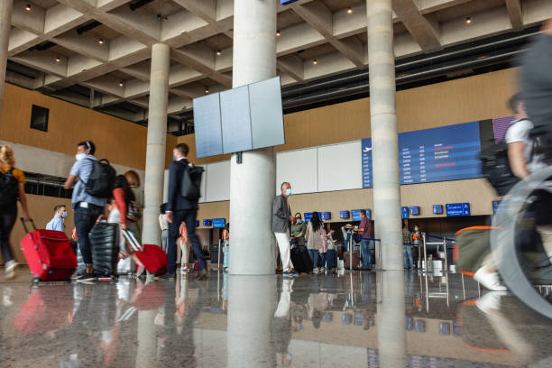 istock Diverse People At The Airport Wearing Protective Face Masks 1767494257