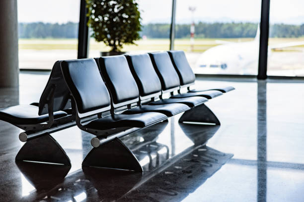 Empty airport departure lounge. Airplanes on the airfield.