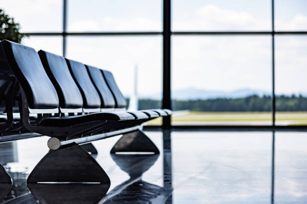Empty airport departure lounge. Airplanes on the airfield.