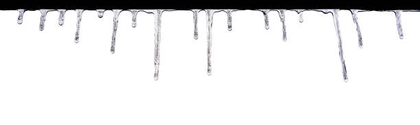istock Closeup of icicles hanging in a row isolated on white background. Spring thaw. 1767509843