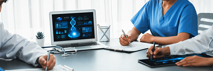 Group of doctor or researcher studying genetic disease in DNA with laptop, analyze genetic data, formulate medical treatment strategies, and develop healthcare plan with innovative solution. Neoteric