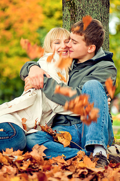 istock Happy young couple in autumn park 176751024