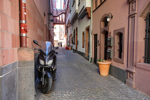 moped parked in a German alley