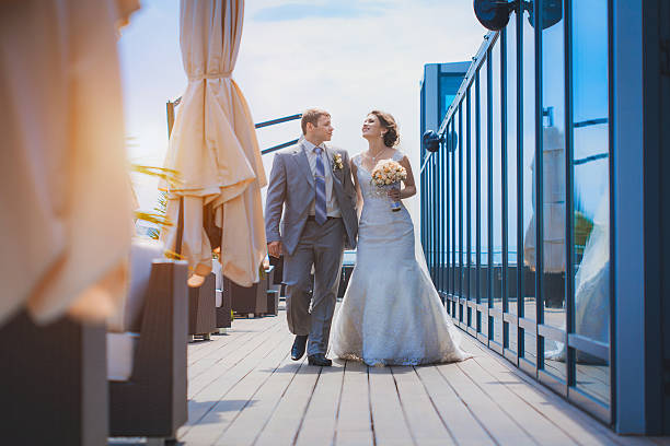 istock bride and groom near the building 176752107