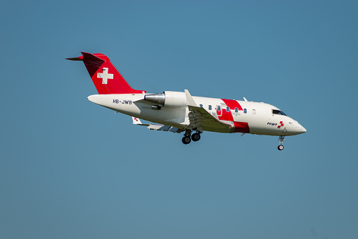 Zurich, Switzerland, September 6, 2023 HB-JWB REGA Swiss air ambulance Bombardier Challenger 650 aircraft arrival on runway 14