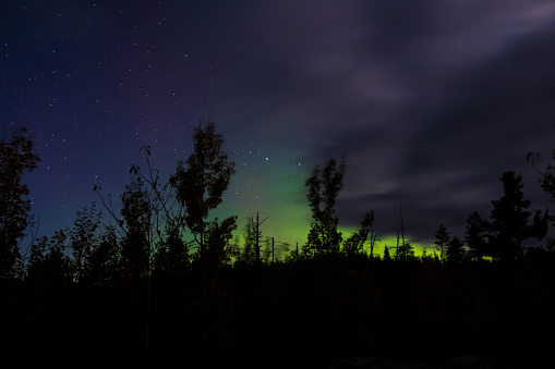 Northern Lights glowing over the Boundary Waters in northern Minnesota