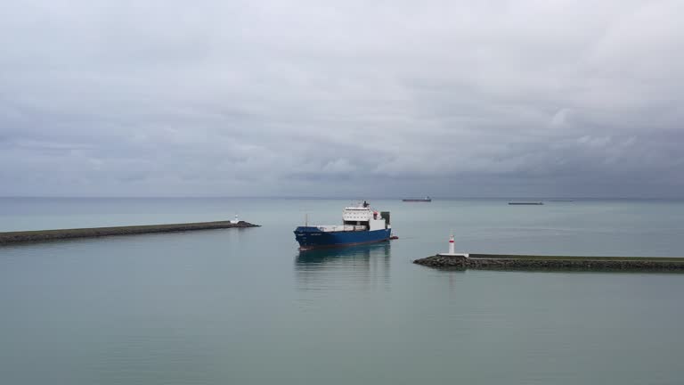 Aerial view of Ro-Ro ship approaching to a commercial port.