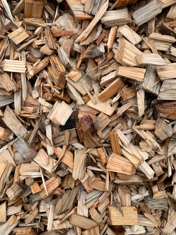 Background texture of large wood chips close-up.