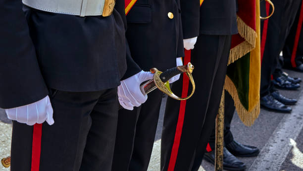 istock Military honor guard with sword and weapon. 1767569651