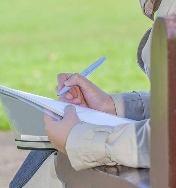 istock Young woman holding a pen 176758149