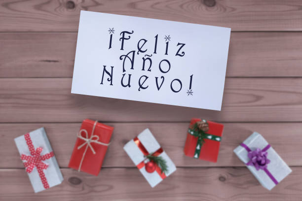 Happy New Year card : Feliz Ano Nuevo lettering in spanish.