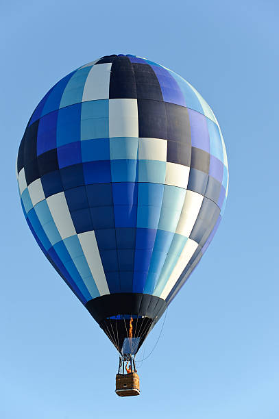 istock Blue checkered hot air balloon in clear sky 176759209