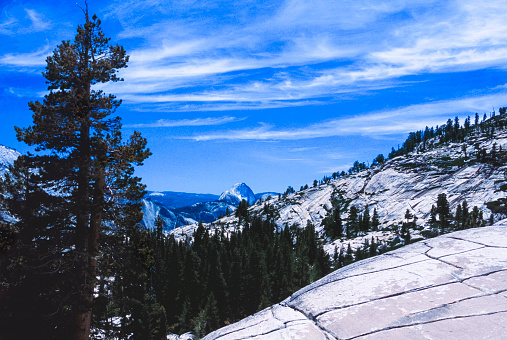 Backside view of Tenaya Canyon trail heading toward Yosemite National Park's Half Dome.\n\nTaken in Yosemite National Park, California, USA