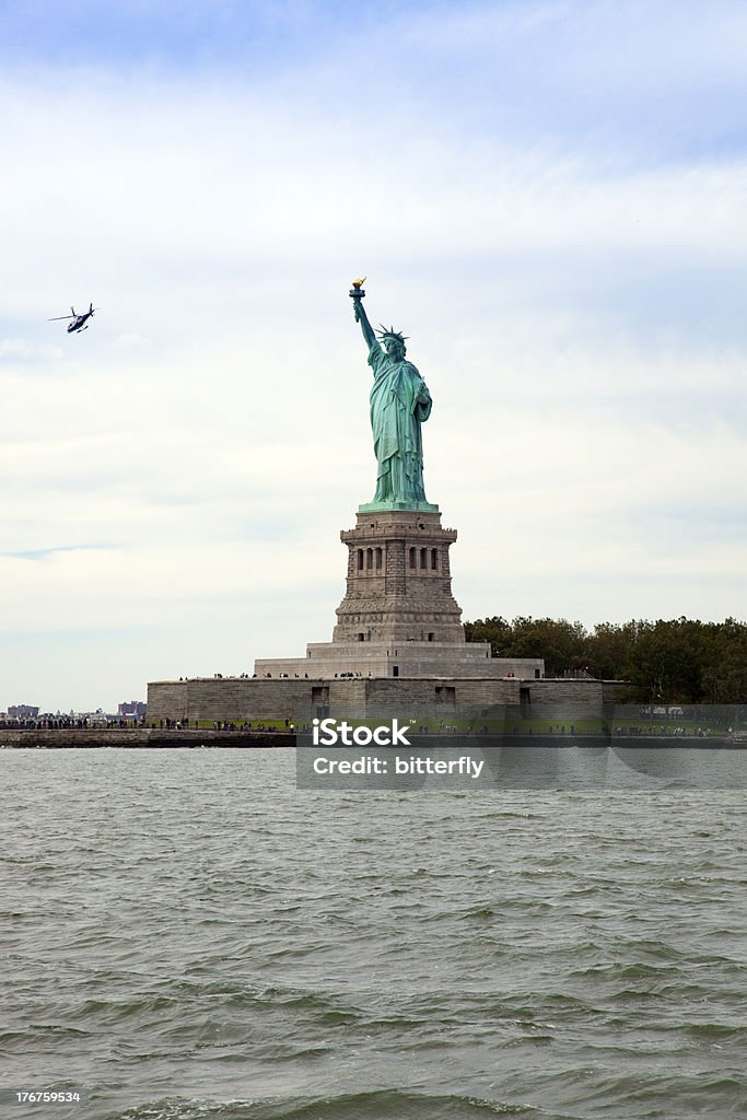 Statue of Liberty Statue of Liberty with the helicopter flying close to itI Love NY: more New York photos Crown - Headwear Stock Photo