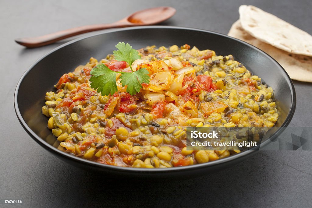 Indian Dal Dahl Curry Meal Food Cuisine Vegetarian "Spicy Indian dal, made from channa dal and urid dal and tempered with onion, tomato and cumin seeds.  More curry" Culture of India Stock Photo