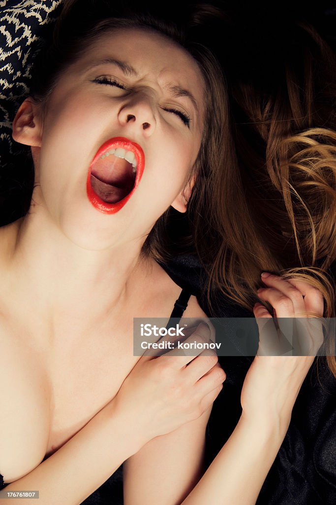 young woman shouting in ecstasy Orgasm Stock Photo