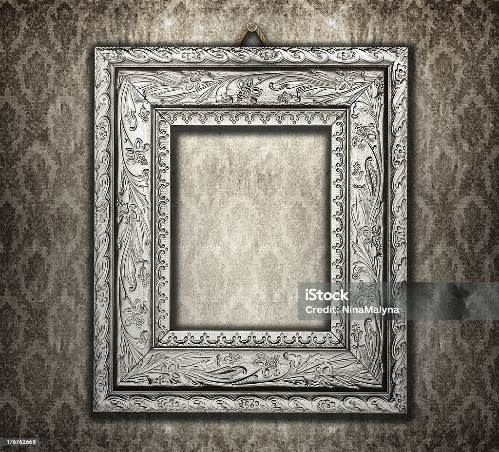 ornate frame on a vintage wallpaper Art Stock Photo