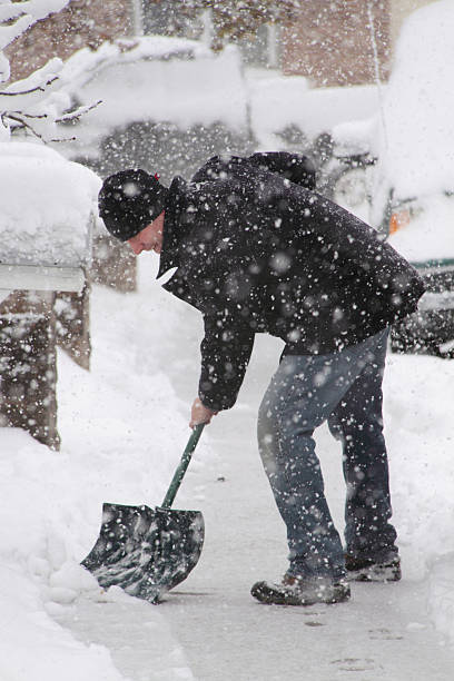 istock Colorado Snow & Man Shoveling on Sidewalk 176763274