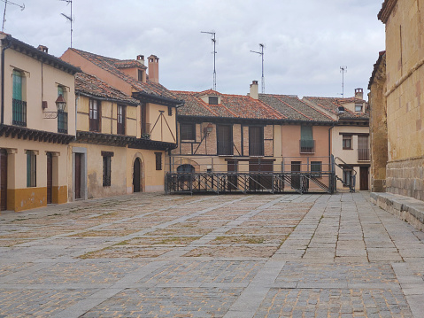 Street of Segovia town in the center of spain with medieval building in a cloudy day