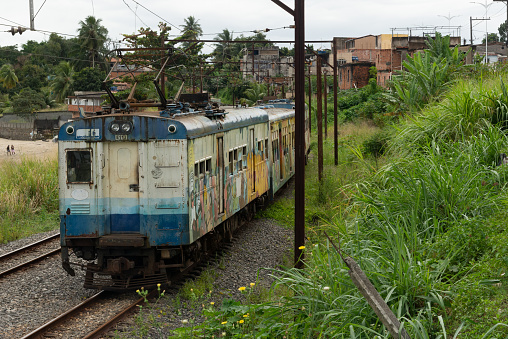 Salvador, Bahia, Brazil - August 30, 2019: Suburban train traveling through the Coutos neighborhood in the city of Salvador, Bahia.