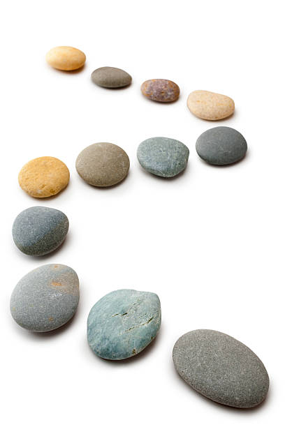 istock Snaking Line of Twelve Pebbles Steps Isolated Vertical 176764210