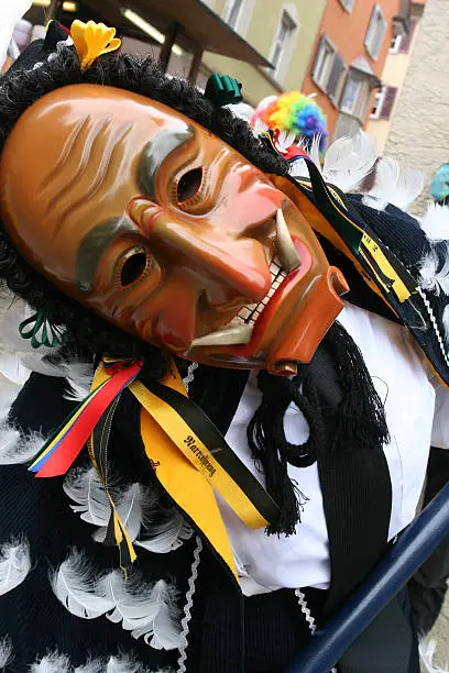 Carnival mask during a traditional carnival parade in South of Germany. This hand-crafted devil's mask was used as a devil's symbol.