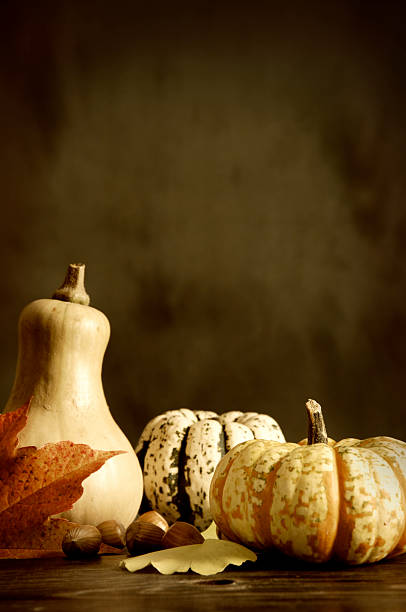 istock Pumpkins and autumn leaves 176764476