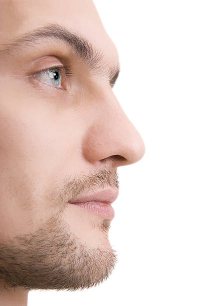 Man's face with blue eyes in a profile stock photo