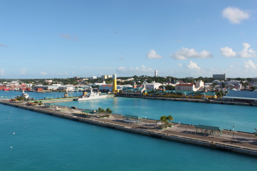 View of the port of Nassau with battleship and cruise ship docks in the forefront