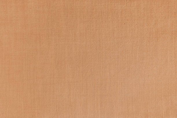 Cтоковое фото Фактурный фон оранжевой льняной ткани, поверхность ткани, плетение из натуральной хлопчатобумажной ткани